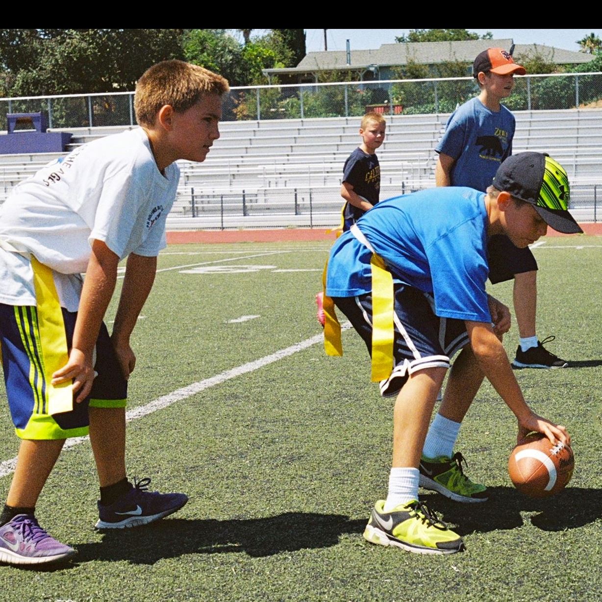 Two boys playing flag football